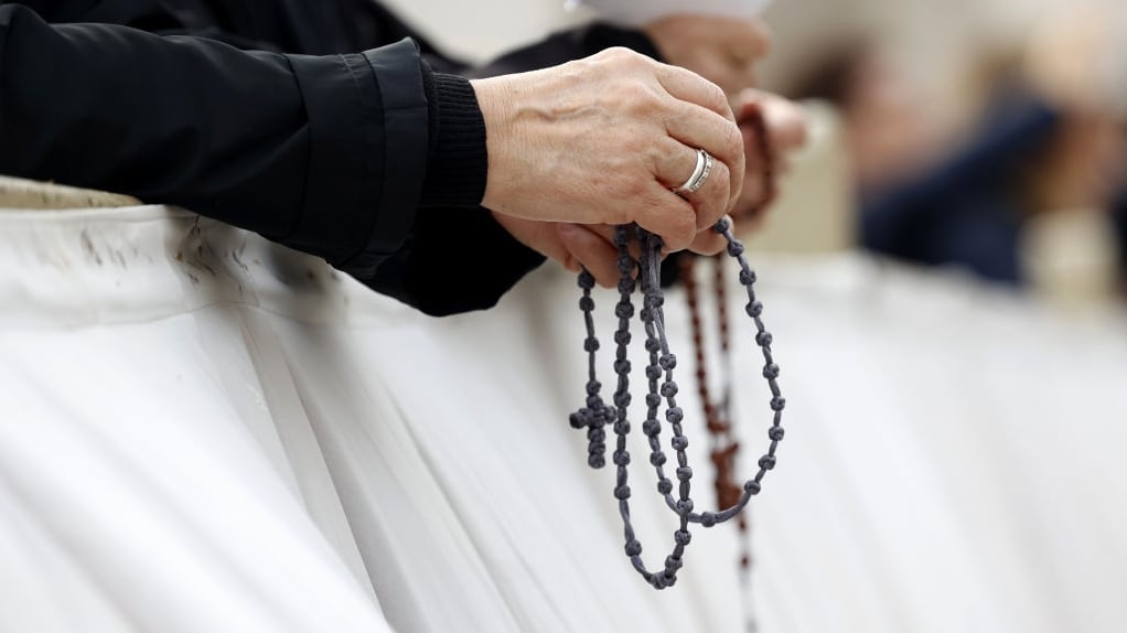 Nuns pray before the start of a Mass at the Vatican.