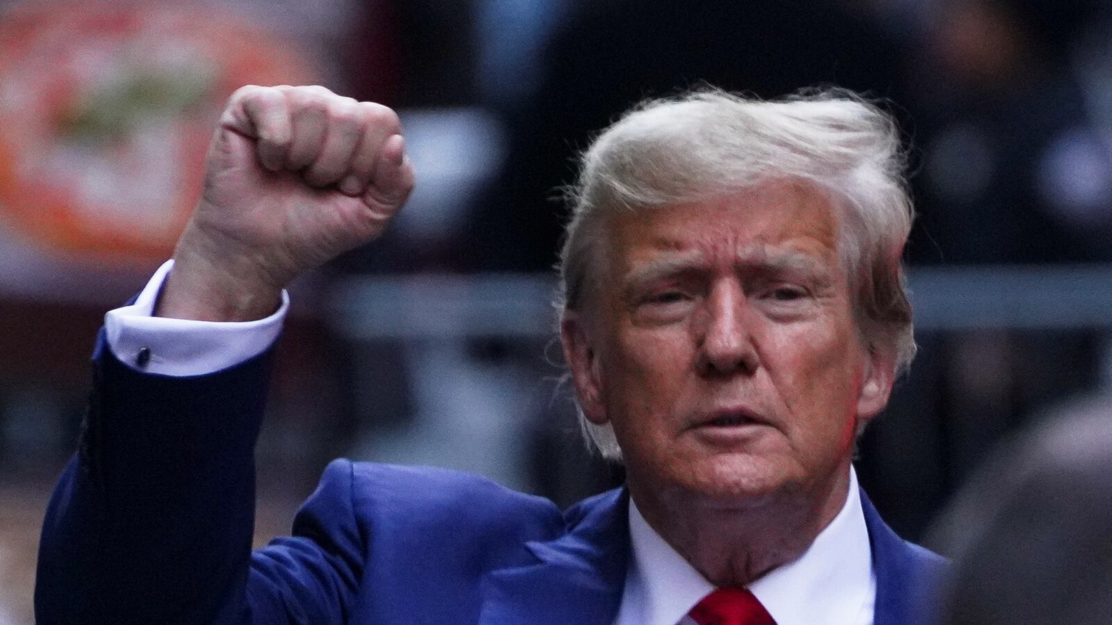 Former President Donald Trump gestures to his supporters, on the day of the closing arguments in the Trump Organization civil fraud trial