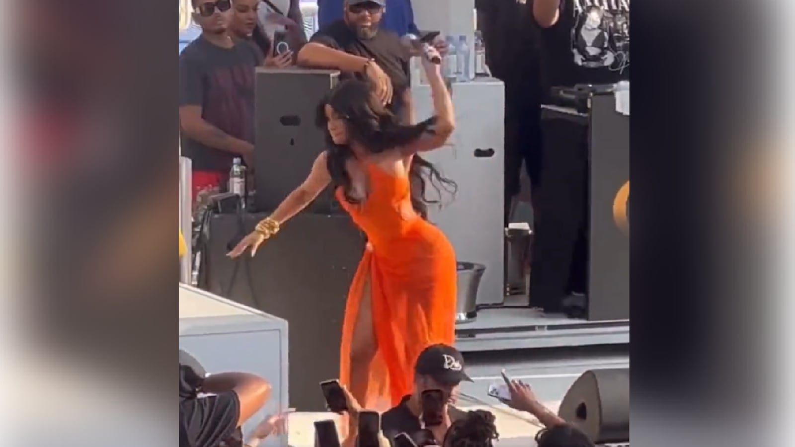 Cardi B throws a microphone at an audience member during a performance in Las Vegas.