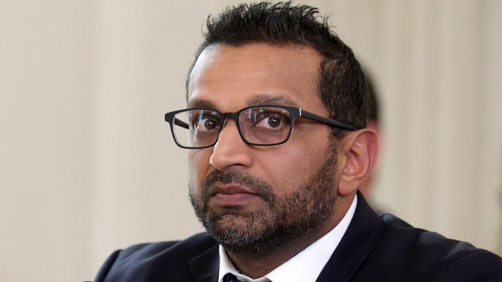 Director of the Federal Bureau of Investigation (FBI) Kash Patel listens as U.S. President Donald Trump delivers an announcement on his Homeland Security Task Force in the State Dining Room of the White House on October 23, 2025 in Washington, DC. Trump announced his administration’s task force has arrested over 3,000 cartel and foreign terrorist members.