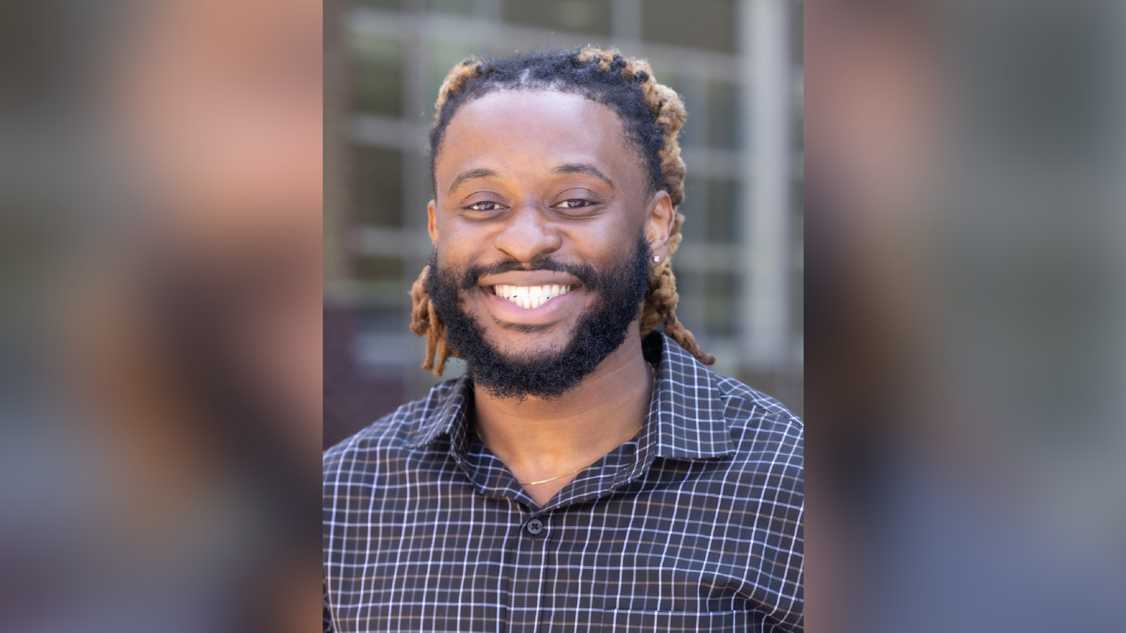 Jason Ogbomoh smiles in a professional headshot.