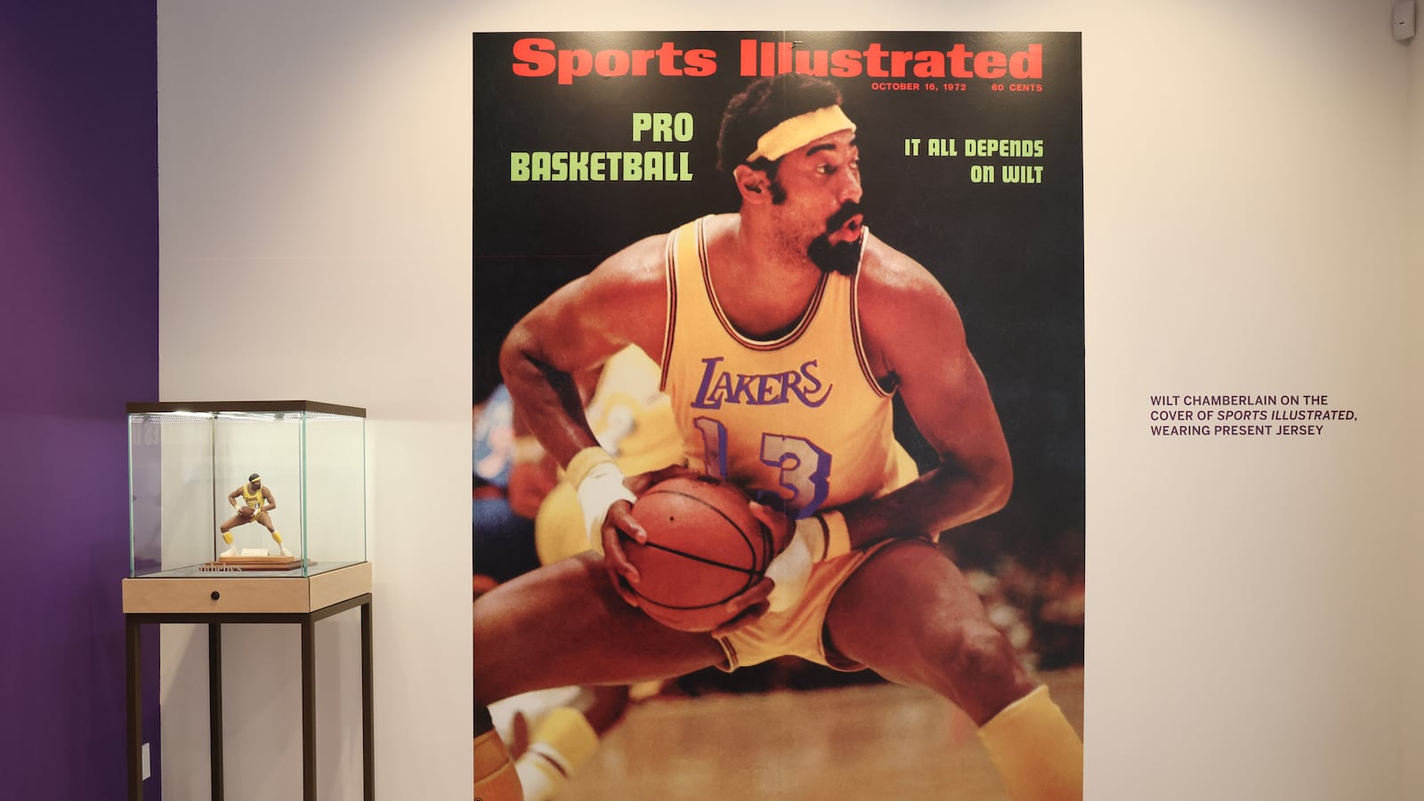 An iconic Sports Illustrated cover and signed limited edition Wilt Chamberlain sports porcelain figurine on display during a press preview at Sotheby's Auction House in August 2023.