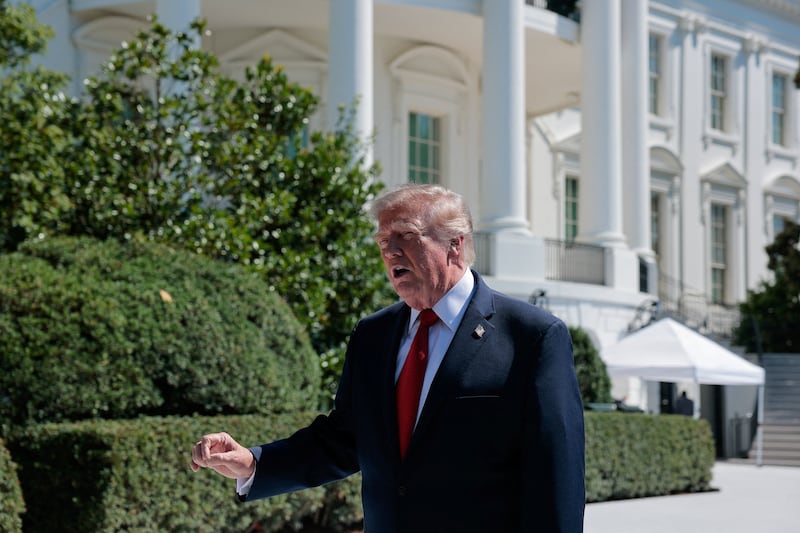 President Donald Trump speaks about the helipad that is being constructed on the South Lawn, at the White House in Washington, D.C., U.S., August 19, 2026.