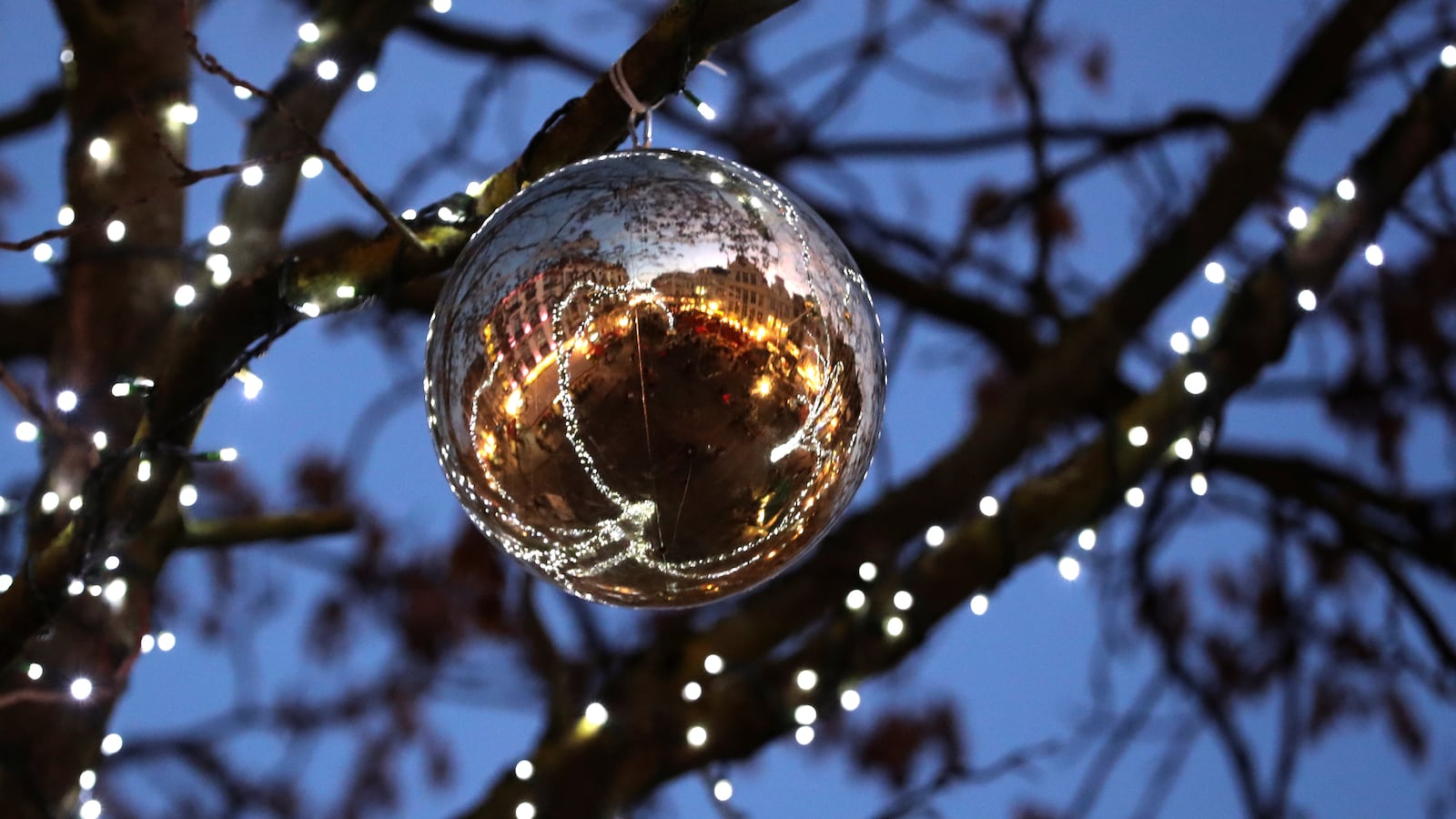 A square is reflected in a Christmas tree ball near Brussels’ Grand Place in central Brussels, Belgium, November 29, 2019.