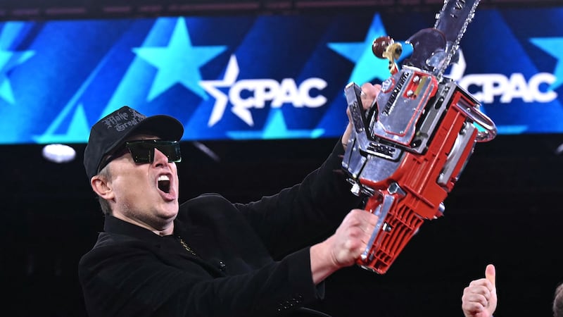 A new report shows that DOGE under Elon Musk, pictured with a chainsaw on February 20, actually wasted $21.7 billion despite its mission to cut government spending.