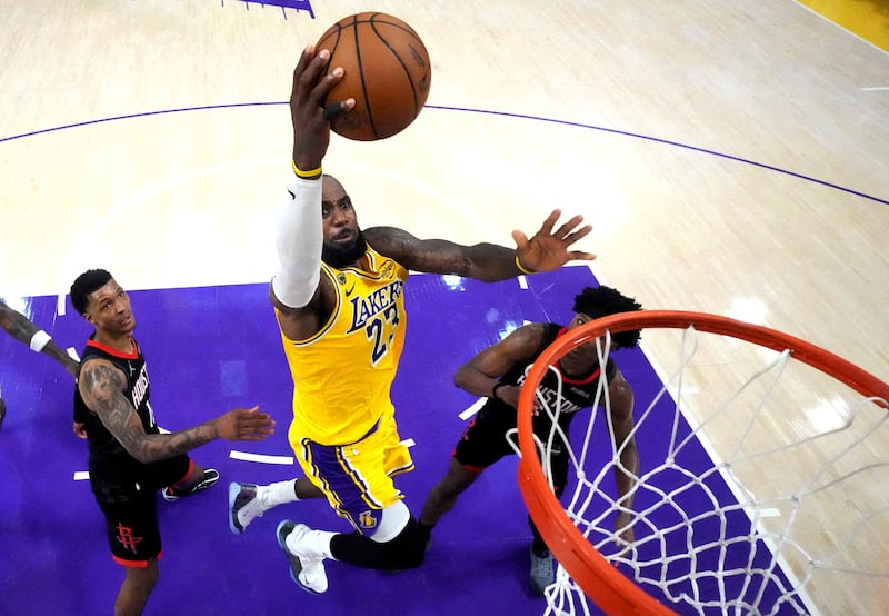 FILE PHOTO: Apr 18, 2026; Los Angeles, California, USA; Los Angeles Lakers forward LeBron James (23) shoots the ball against Houston Rockets forward Jabari Smith Jr. (10) and guard Amen Thompson (1) in the second half during game one of the first round of the 2026 NBA Playoffs at Crypto.com Arena. Mandatory Credit: Kirby Lee-Imagn Images/File Photo