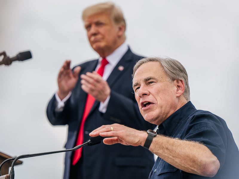 Texas Gov. Greg Abbott speaks alongside former President Donald Trump during a tour to an unfinished section of the border wall on June 30, 2021 in Pharr, Texas.