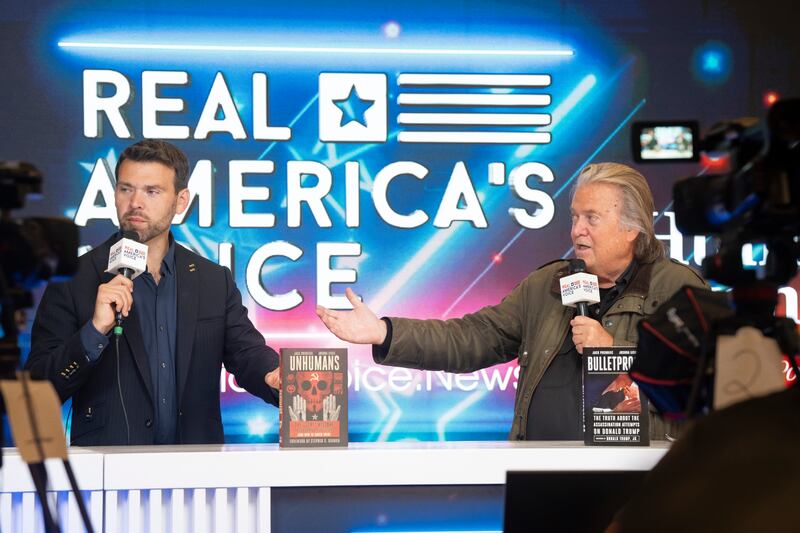Conservative political activist and host of Human Events Jack Posobiec and former Trump adviser Steve Bannon broadcast live during Turning Point USA's AmericaFest