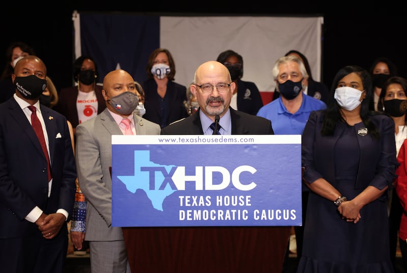 Texas State Rep. Jon Rosenthal (D-135), joined by fellow Democratic Texas state representatives, speaks at a press conference.