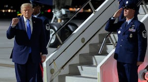 President Donald Trump walks off Air Force One on his West Coast trip.