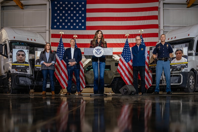 U.S. Secretary of Homeland Security Kristi Noem (C) speaks alongside (L-R) ICE Deputy Director Madison Sheahan, Acting Immigration and Customs Enforcement Director Todd Lyons, Indiana Gov. Mike Braun, and Indiana Secretary of Public Safety Anthony Scott