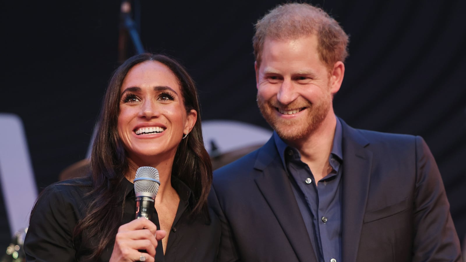Prince Harry, Duke of Sussex and Meghan, Duchess of Sussex speak on stage at the "Friends @ Home Event" at the Station Airport during day three of the Invictus Games Düsseldorf 2023 on September 12, 2023 in Duesseldorf, Germany.