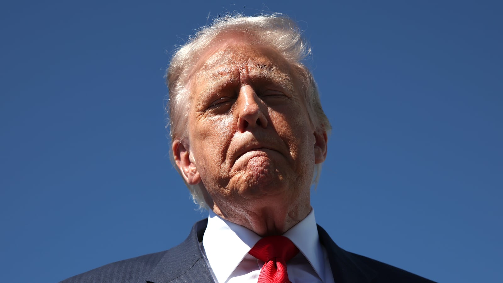 WEST PALM BEACH, FLORIDA - OCTOBER 31: US President Donald Trump speaks to reporters as he arrives at Palm Beach International Airport on October 31, 2025 in West Palm Beach, Florida. Trump is spending the weekend at his Mar-A-Lago estate in Palm Beach, Florida. (Photo by Samuel Corum/Getty Images)