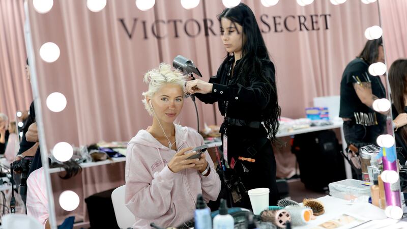 NEW YORK, NEW YORK - OCTOBER 15: Iris Law prepares backstage at the Victoria's Secret Fashion Show 2025 on October 15, 2025 in New York City.