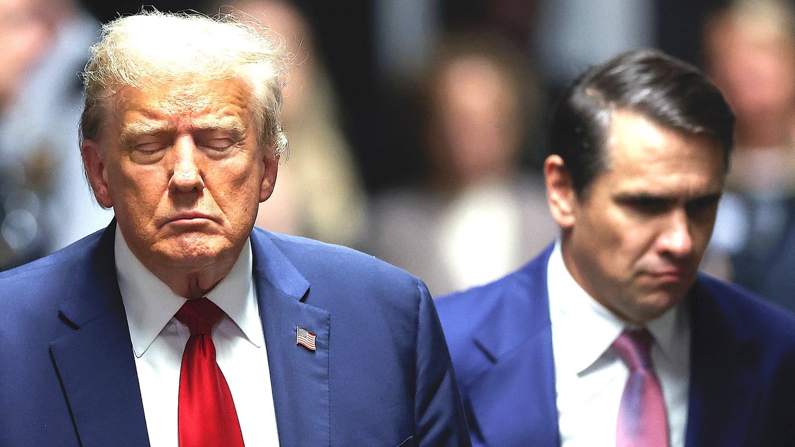 Former U.S. President Donald Trump closes his eyes as he leaves court during his trial for allegedly covering up hush money payments