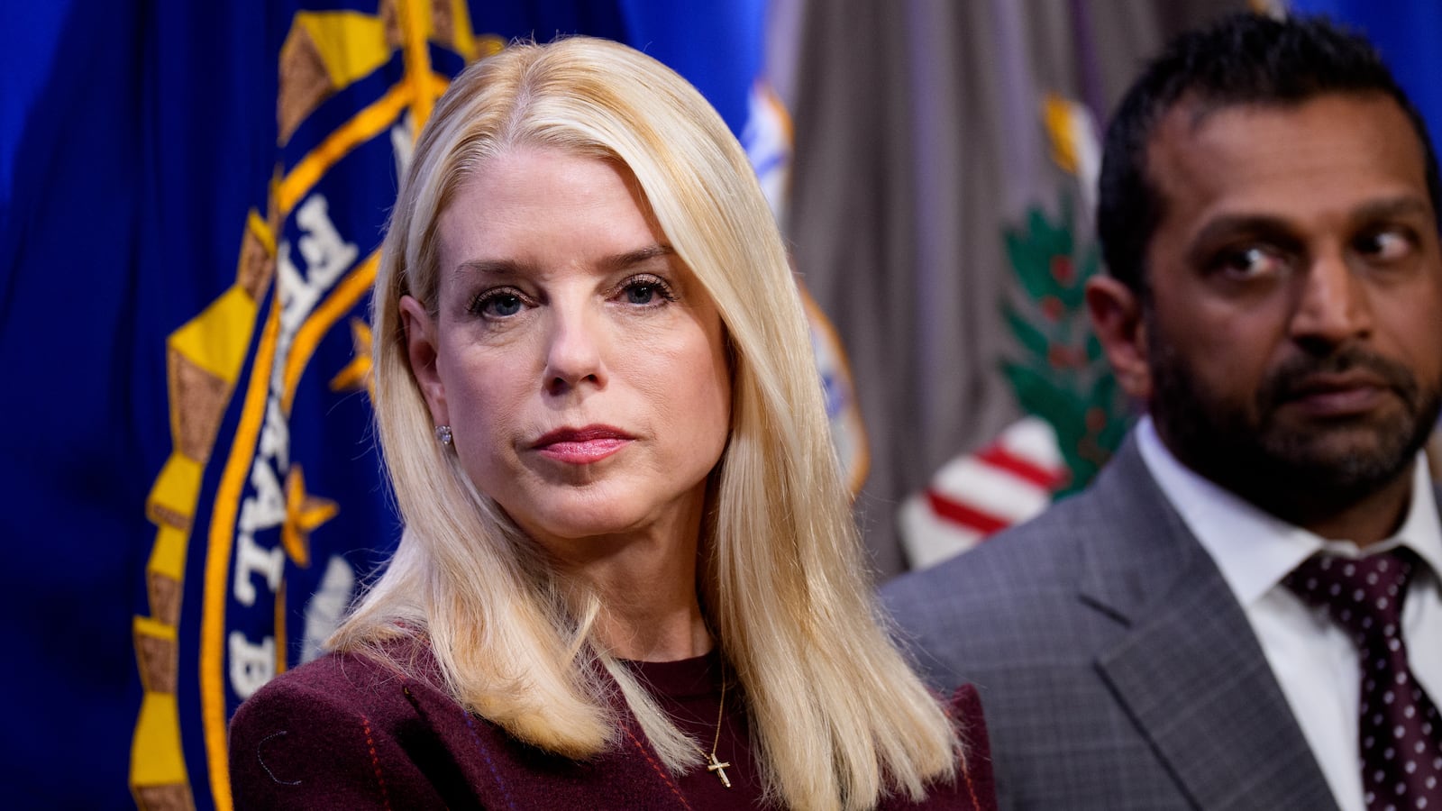 Attorney General Pam Bondi and FBI Director Kash Patel (R) appear during a news conference