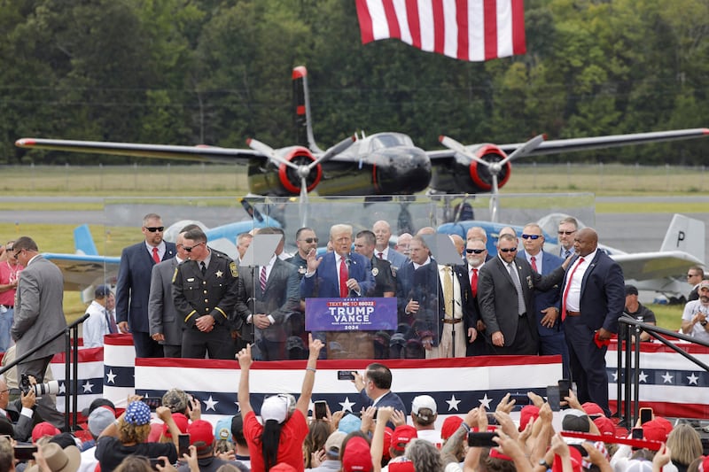 Robinson (far right) with Trump at a rally in 2024. The then-lieutant governor would go on to lose by more than 14 points.