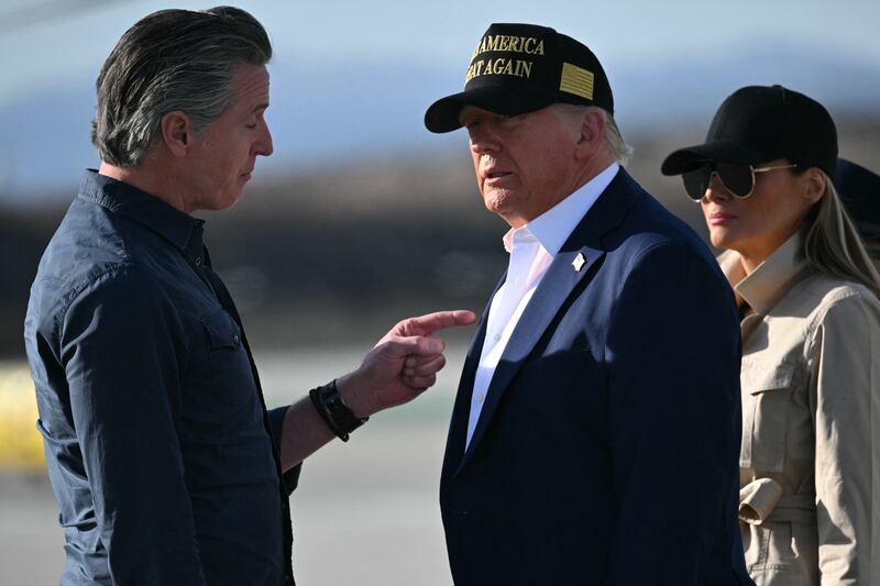 US President Donald Trump and First Lady Melania Trump are greeted by California Governor Gavin Newsom upon arrival at Los Angeles International Airport in Los Angeles, California, on January 24, 2025, to visit the region devastated by the Palisades and Eaton fires.