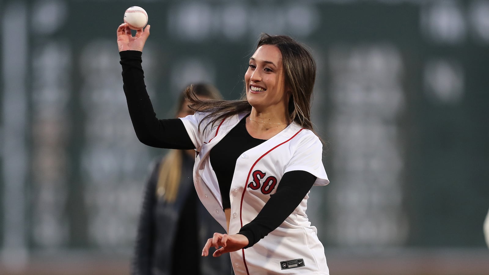 Karenna Groff, NCAA Woman of the Year, throws out the first pitch at Fenway Park in April 2023.