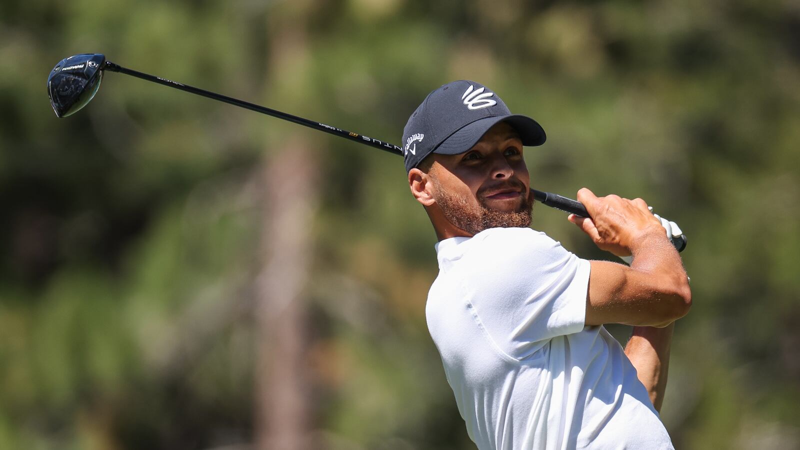 A picture of Stephen Curry at the 2023 American Century Championship in Stateline, Nevada, where he hit a hole-in-one on the 7th hole, 152 yards away from the green.