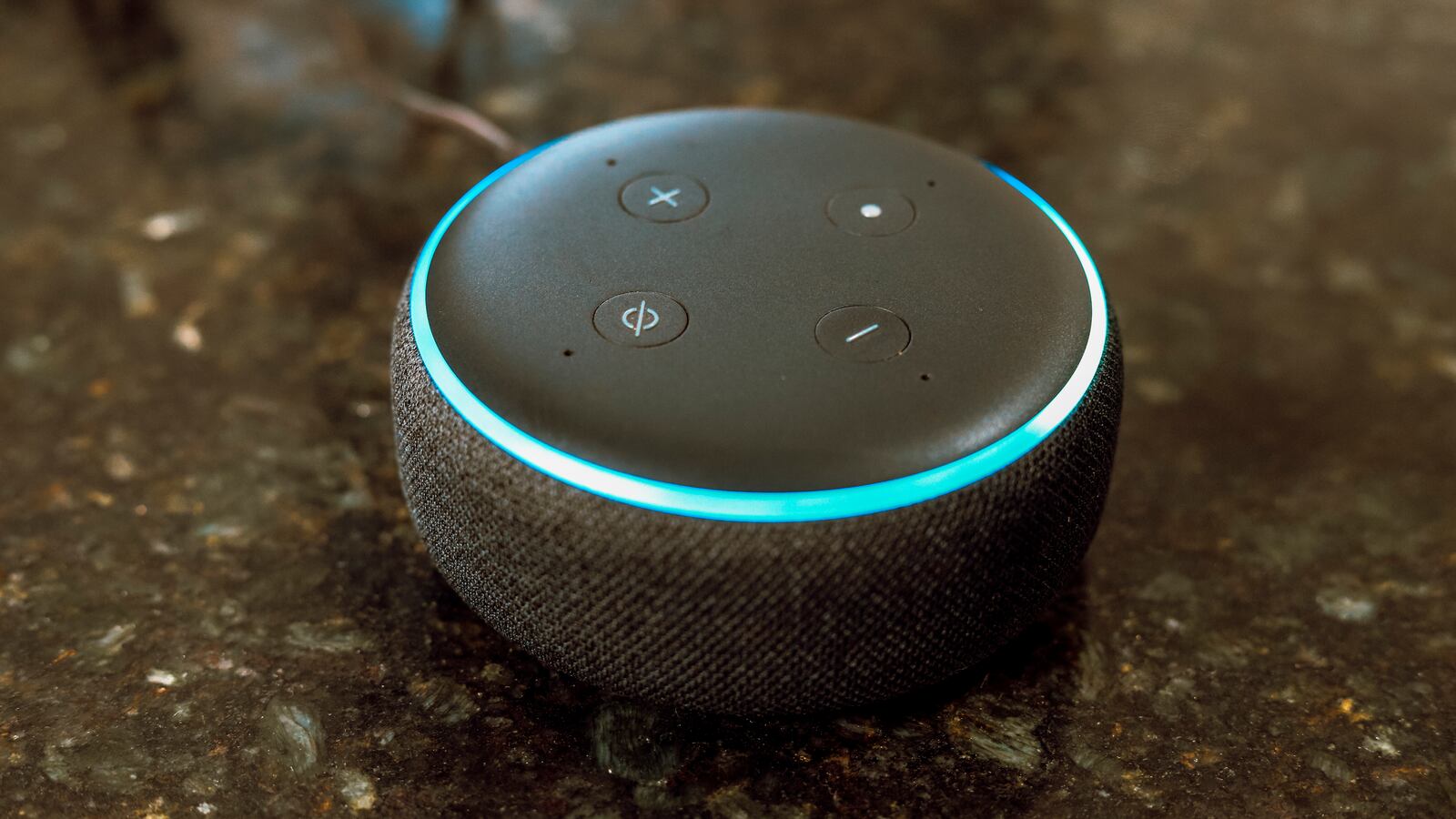A photo of an Echo Dot on a counterop.