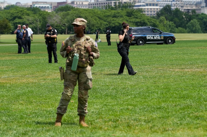 Authorities responded to what appeared to be a large tracing of the term 8647 into the grounds of the National Mall in Washington, D.C., U.S., June 11, 2026. A Reuters photographer captured the emerging image from atop the Washington Monument on the Mall's grass shortly before authorities arrived. The arrangement of the numbers was clearly an attempt to show 8647, though the 4 was not fully formed. Federal prosecutors on other occasions have said the term could indicate a threat to President Trump, the 47th U.S. president. REUTERS/ Nathan Howard