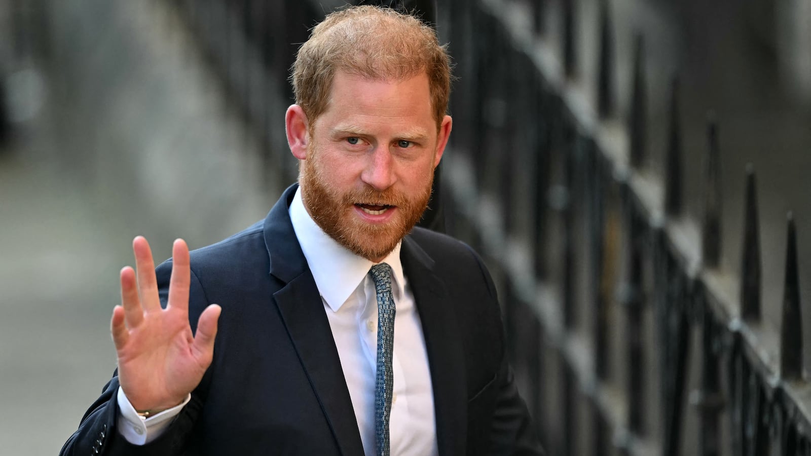 TOPSHOT - Britain's Prince Harry, Duke of Sussex waves as he arrives at the the Royal Courts of Justice, Britain's High Court, in central London, on April 8, 2025. Prince Harry will push ahead with a court challenge in London on Tuesday as the self-exiled royal fights a decision to downgrade his personal security when he visits Britain. Following Harry's dramatic split with the royal family in 2020 and subsequent move to North America, the British government said he would no longer be given the "same degree" of publicly funded protection when in the UK. (Photo by JUSTIN TALLIS / AFP) (Photo by JUSTIN TALLIS/AFP via Getty Images)