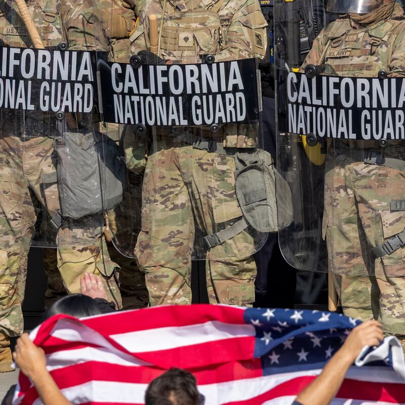 LOS ANGELES, CALIFORNIA - JUNE 09: Protesters confront California National Guard soldiers and police outside of a federal building as protests continue in Los Angeles following three days of clashes with police after a series of immigration raids on June 09, 2025 in Los Angeles, California. Tensions in the city remain high after the Trump administration called in the National Guard against the wishes of city leaders. (Photo by David McNew/Getty Images)