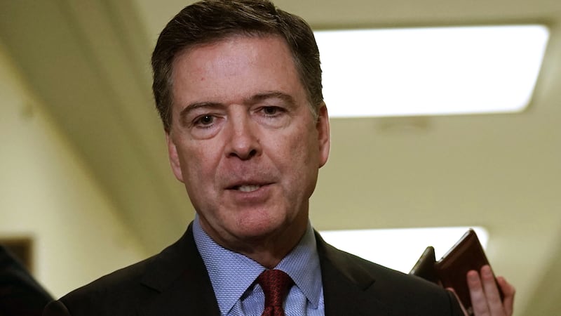 James Comey speaks to members of the media at the Rayburn House Office Building after testifying to the House Judiciary and Oversight and Government Reform committees on Capitol Hill December 07, 2018 in Washington, DC.