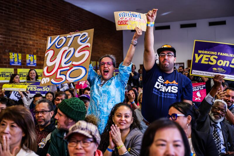 People cheer during a campaign event in support of Proposition 50 in San Francisco, Monday, Nov. 3, 2025.
