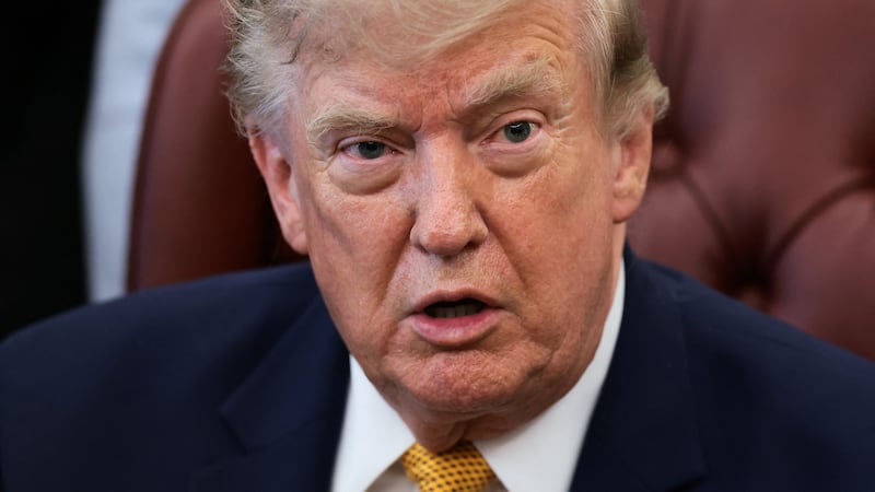 U.S. President Donald Trump answers questions from the media after signing an executive order establishing the President's Military Spouse Commission to be chaired by Jennifer Rauchet, wife of Secretary of Defense Pete Hegseth, in the Oval Office at the White House in Washington, D.C., U.S., August 3, 2026. REUTERS/Evelyn Hockstein