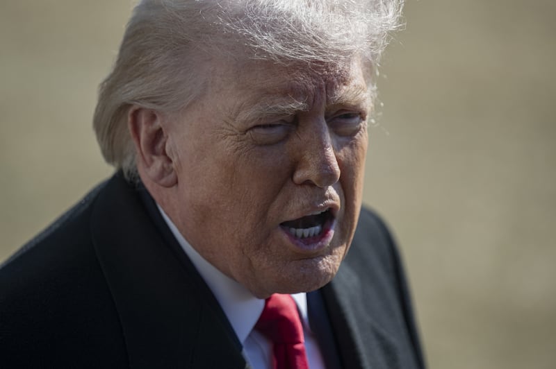 Donald Trump speaks to the press before departing from the White House en route to Fayetteville, North Carolina, on February 13, 2026, in Washington, DC.