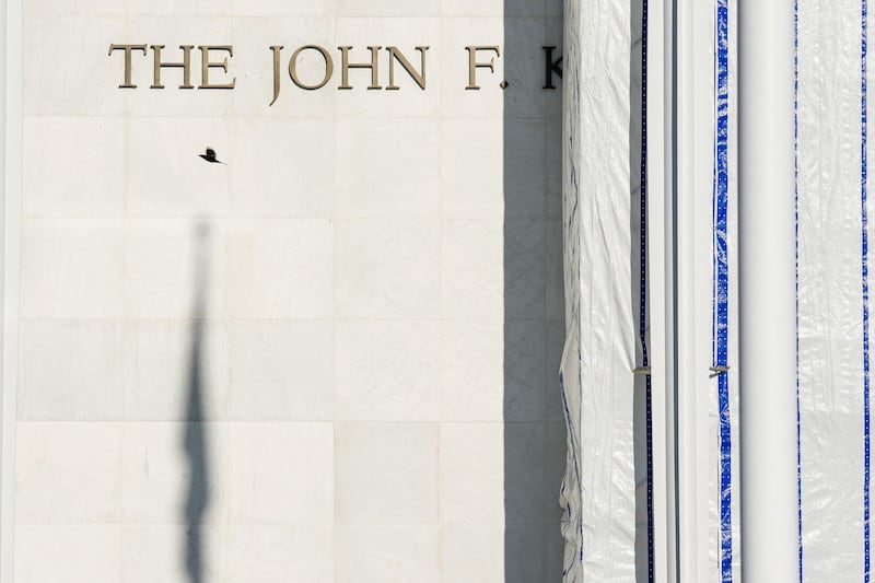 The scaffolding with a tarp remains after the removal of the lettering early this morning from the facade of the John F. Kennedy Memorial Center