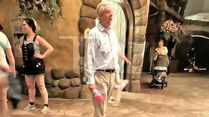 Sen. Lindsey Graham walking with a bubble wand at Disney World. *Permission granted by TMZ to use*
