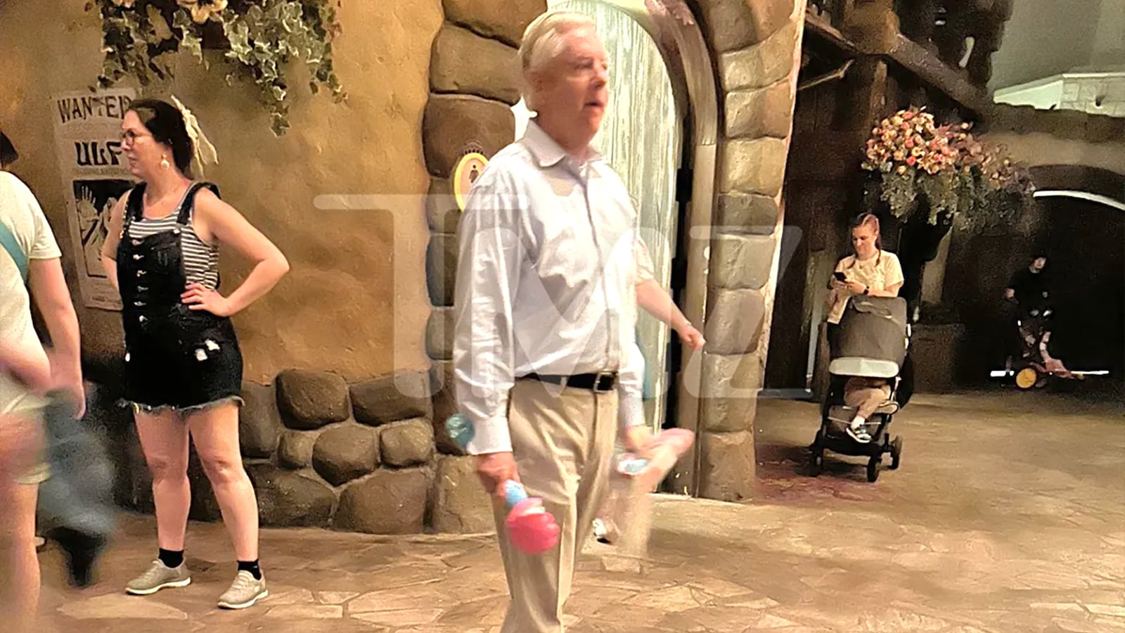 Sen. Lindsey Graham walking with a bubble wand at Disney World. *Permission granted by TMZ to use*