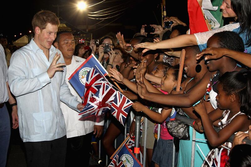 articles/2012/03/03/harry-parties-in-the-belize-night/prince-harry-belize-greeting-royalist-sykes_yku8ql