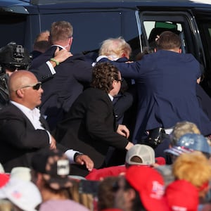 Republican presidential candidate and former U.S. President Donald Trump gets into a vehicle with the assistance of U.S. Secret Service personnel after assassination attempt