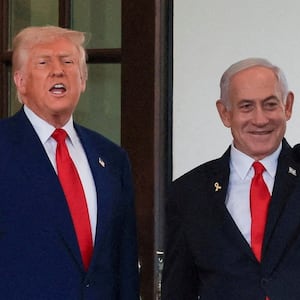 President Donald Trump speaks as Israeli Prime Minister Benjamin Netanyahu waves following a meeting in the White House.