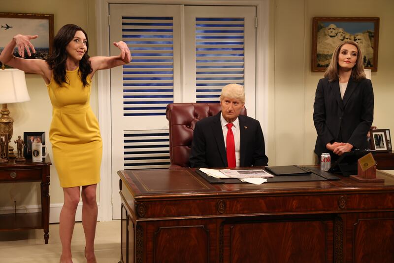 SATURDAY NIGHT LIVE -- Miles Teller, Kendrick Lamar Episode 1827 -- Pictured: (l-r) Heidi Gardner as Gov Kristi Noem, James Austin Johnson as Donald Trump, and Chloe Fineman during the Manningcast Cold Open on Saturday, October 1, 2022 -- (Photo by: Will Heath/NBC via Getty Images)