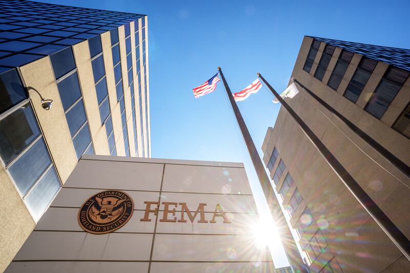 The sign flares behind the sign marking the location of the Federal Emergency Management Agency (FEMA) headquarters building