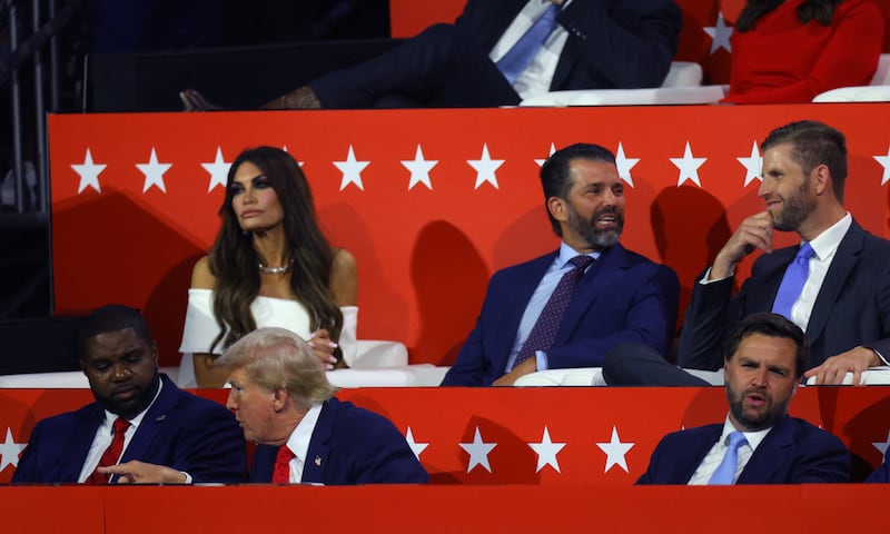 Republican presidential nominee and former U.S. President Donald Trump, Republican vice presidential nominee J.D. Vance, Donald Trump Jr., Kimberly Guilfoyle, Eric Trump, and  Rep. Byron Donalds (FL)  sit during Day 1 of the Republican National Convention (RNC), at the Fiserv Forum in Milwaukee, Wisconsin, U.S., July 15, 2024.