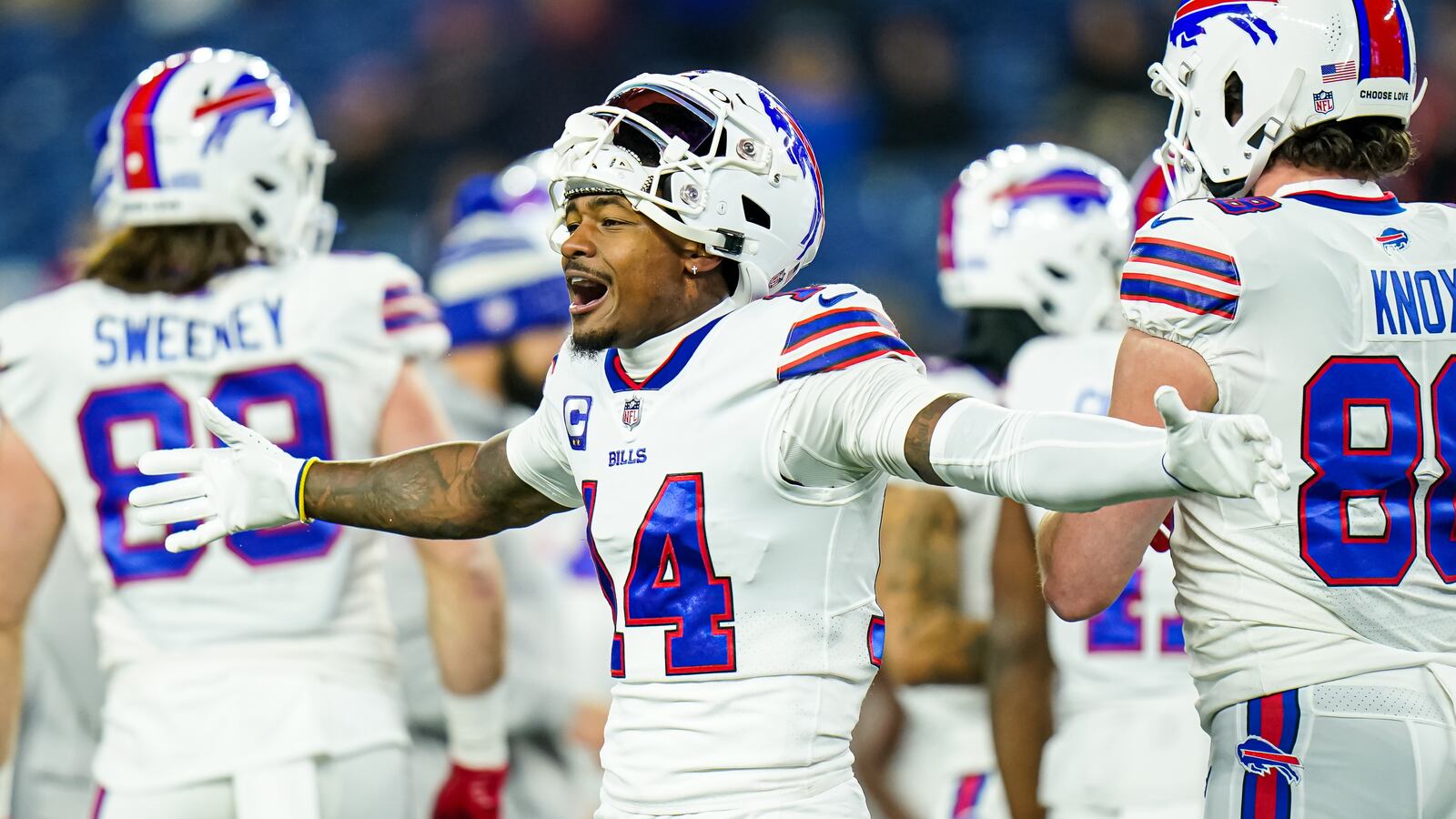 Stefon Diggs has his arms spread during warm-ups of a Buffalo Bills football game.