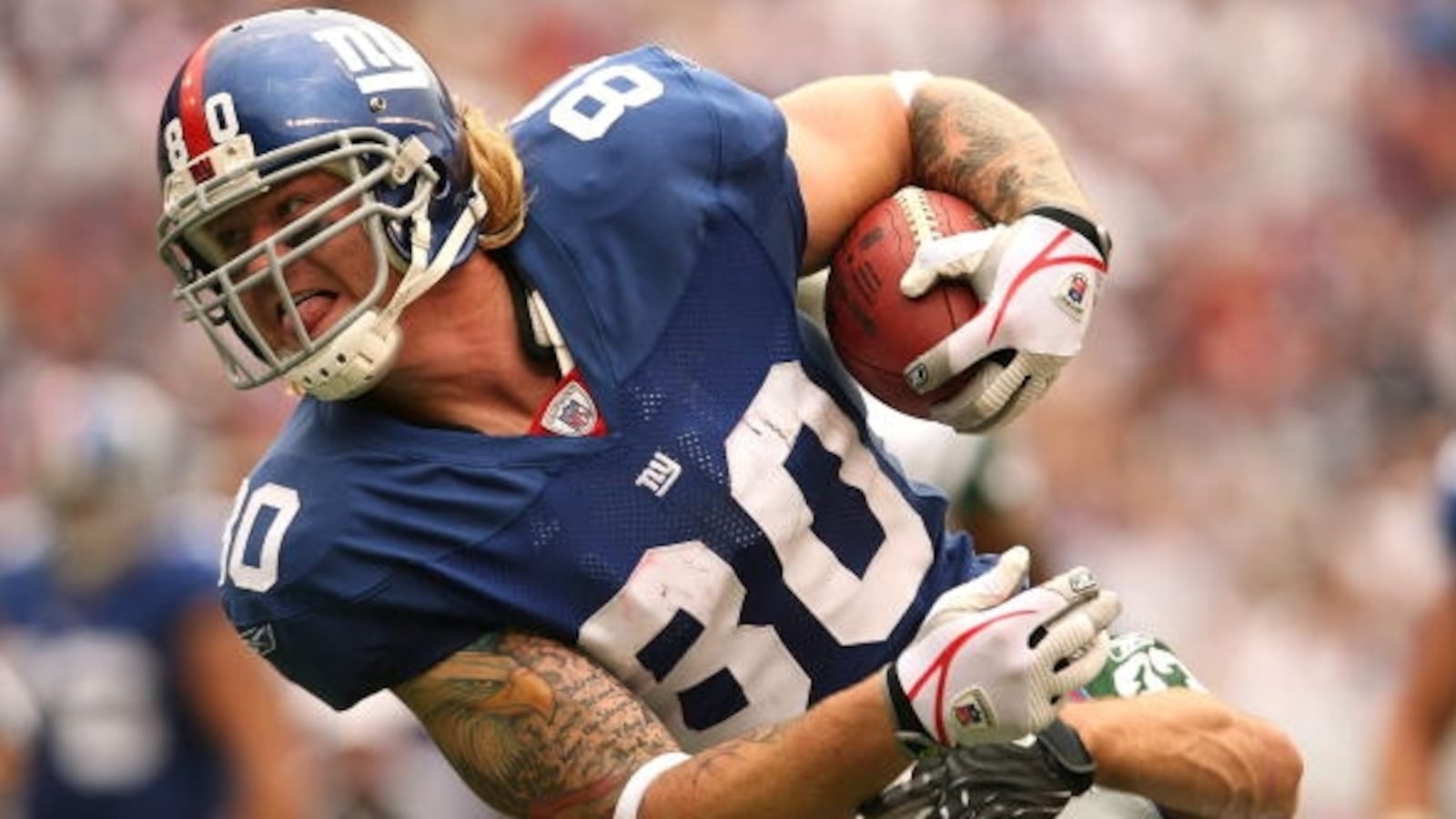 EAST RUTHERFORD, NJ - OCTOBER 7: Jeremy Shockey #80 of the New York Giants runs the ball against the New York Jets at Giants Stadium on October 7, 2007 in East Rutherford, New Jersey. (Photo by Nick Laham/Getty Images)