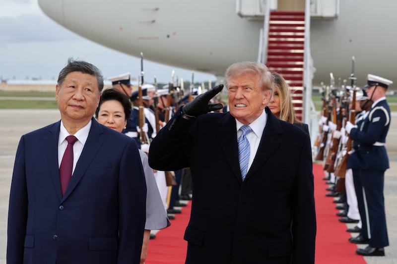 President Donald Trump salutes next to Chinese President Xi Jinping as he arrives ahead of a state visit at Joint Base Andrews, Maryland, US, September 23, 2026.