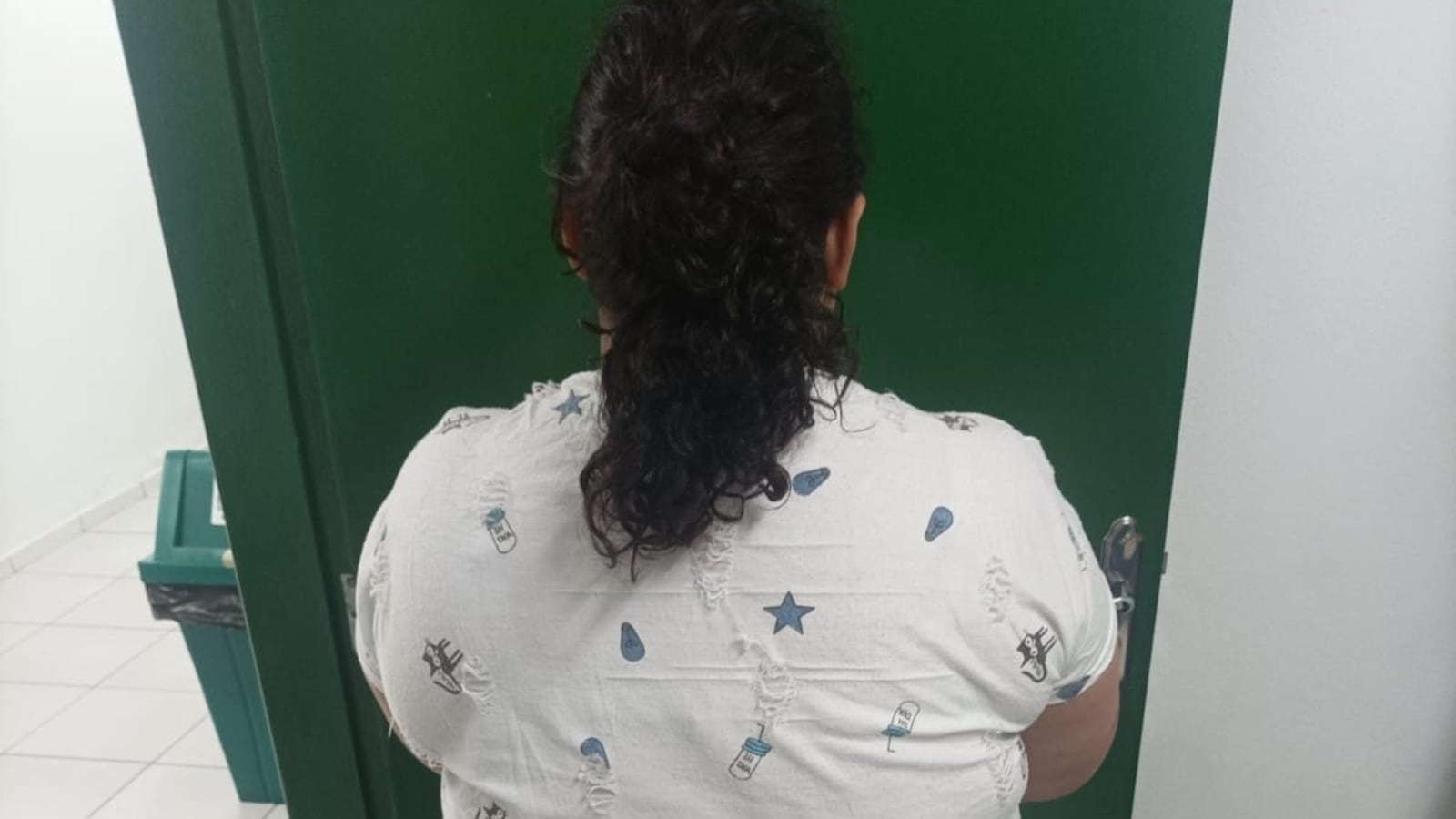 Police photo of the adult suspect's back.