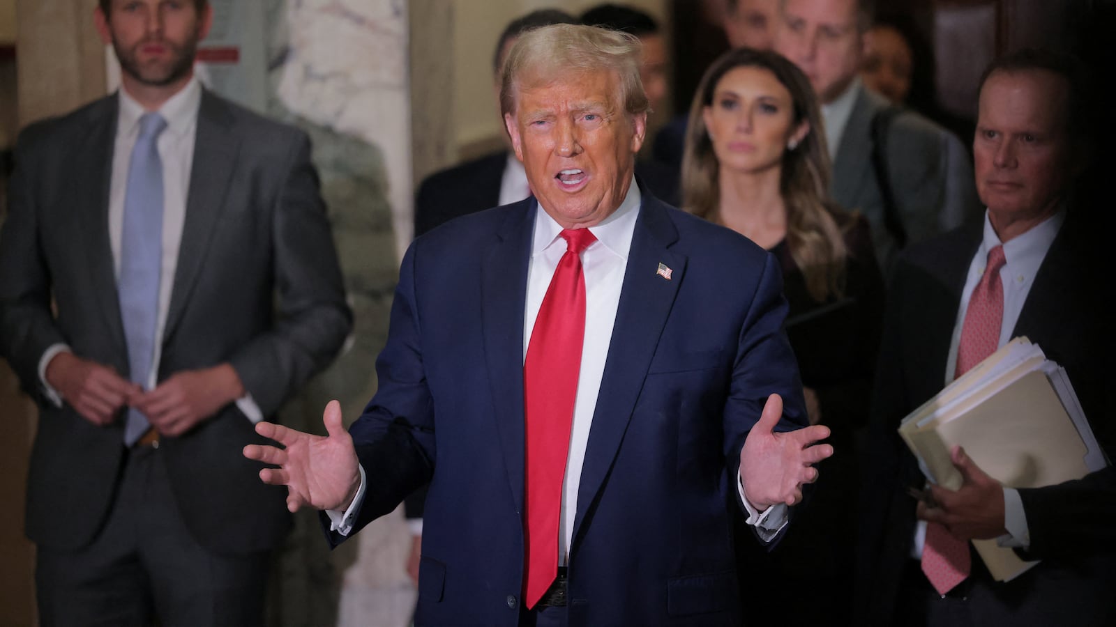 Donald Trump speaks to the media as he attends a Manhattan courthouse trial in a civil fraud case in New York, U.S., October 17, 2023.