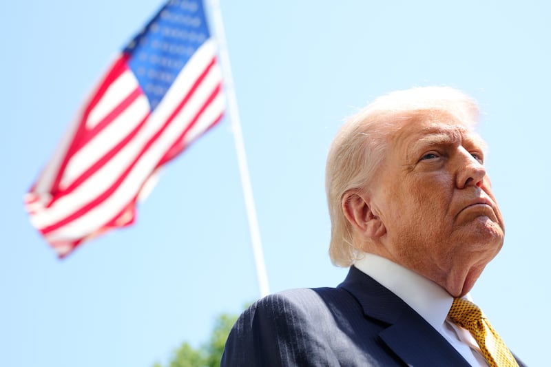 WASHINGTON, DC - MAY 12: U.S. President Donald Trump speaks in front of the American flag to the press as he departs the White House on May 12, 2026 in Washington, DC. Trump is traveling to China, where he is scheduled to meet with Chinese President Xi Jinping for expected talks on the Iran conflict, trade imbalances, regional security, and economic cooperation between the two countries. (Photo by Kevin Dietsch/Getty Images)