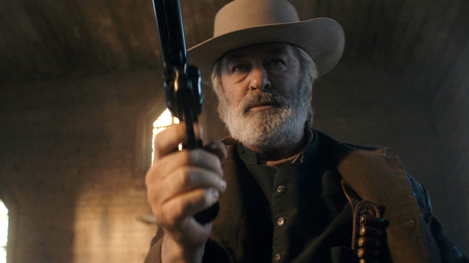 Alec Baldwin practicing a scene with a revolver on the set of Rust.