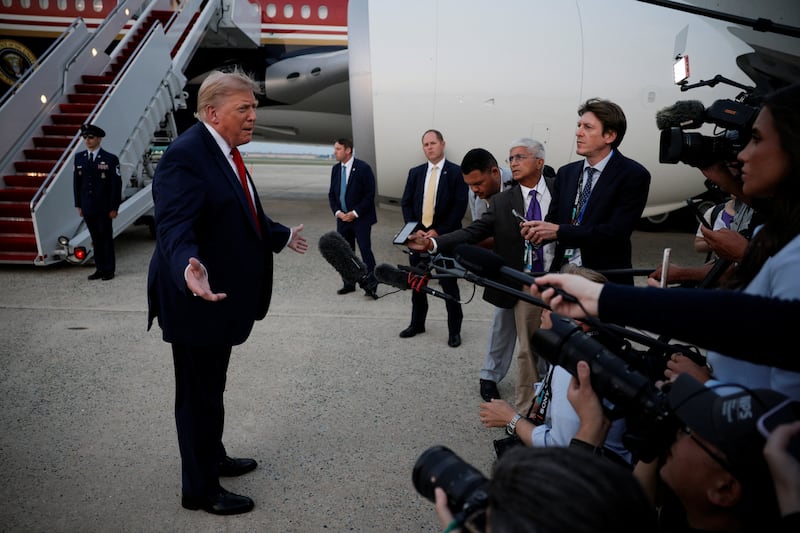 U.S. President Donald Trump speaks with the media as he arrives at Joint Base Andrews in Maryland, U.S., July 19, 2026.