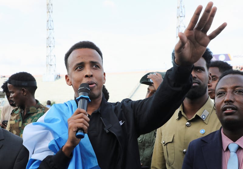 Somali referee Omar Abdulkadir Artan, who was expected to officiate at matches during the 2026 FIFA World Cup but was denied entry to U.S., addresses fans at the Mogadishu stadium, in Mogadishu.